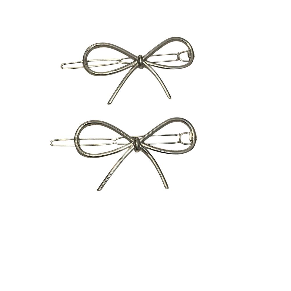 Silver bow clasp barrettes pair